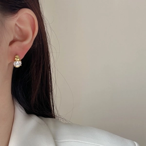 Elegant gold zircon stud earrings for women shown on model for a minimalist fashion look