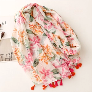 Lightweight floral print scarf with pink fringe tassels and elegant botanical pattern