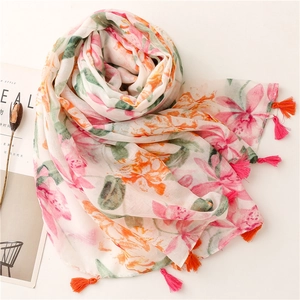 Floral print scarf with tassel edge on white background, lightweight cotton-linen feel