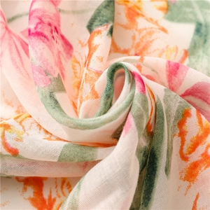 Detail of floral printed breathable mesh scarf showing pink and orange petal textures