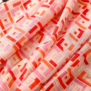 Detail view of ethnic geometric print scarf showing soft cotton-linen fabric texture