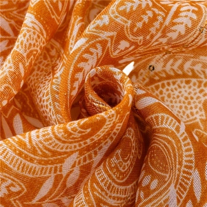 Orange bohemian scarf with white mandala patterns and sparkling gold sequins