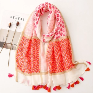 Ethnic style cotton feel scarf with geometric floral patterns and pink orange tassels