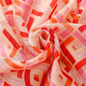 Ethnic geometric sun protection shawl with red and orange patterns in light mesh fabric