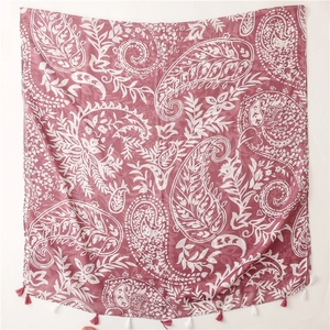 Detail of pink paisley shawl with lightweight fabric and bicolor tassel fringe decoration