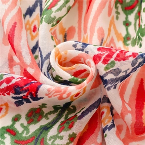 Macro detail of Bohemian Ikat patterned cotton-linen scarf with colorful geometric prints