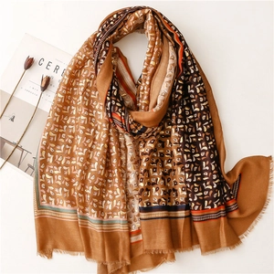 Elegant gold-tone cotton linen scarf with ethnic leaf patterns and fringe edges