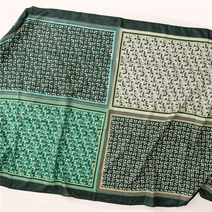 Detail of four-grid patchwork scarf featuring green floral patterns and botanical prints