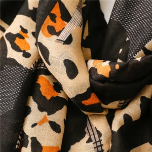 Detailed view of the leopard print cotton linen scarf showing soft fabric texture
