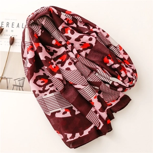 Close-up of leopard and grid pattern patchwork scarf with soft cotton-linen texture