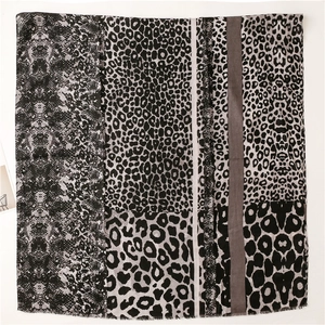 Detail of leopard and snake print mix on lightweight cotton linen scarf with frayed edges
