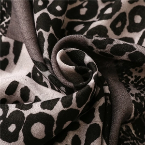 Detailed macro view of leopard print cotton linen fabric with soft diagonal twill texture