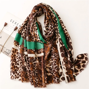Cotton linen shawl scarf featuring leopard and snake prints with green stripes and frayed edges