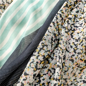 Macro detail of various patterns including green stripes, navy polka dots and floral prints