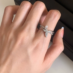Zircon swallow open ring with small pearl detail on a silver-toned adjustable band