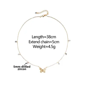 Detail of gold butterfly pendant necklace with 5mm cubic zirconia on a delicate chain
