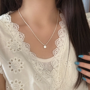 Elegant S925 silver necklace with sparkling round zircon pendant on model