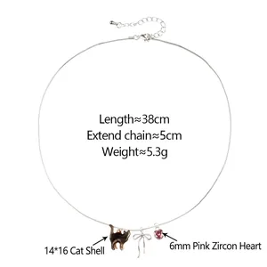 Collana gatto in conchiglia con cuore in zircone rosa e fiocco su catena d'argento