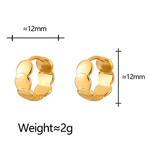 Detailed close-up of 12mm golden wavy hoop earrings with high-polish finish