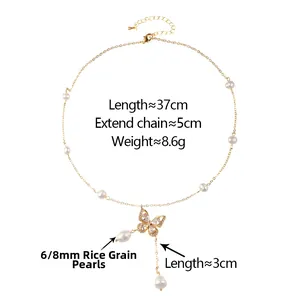 Detail of gold butterfly necklace with 6/8mm rice pearls and elegant pendant tassel