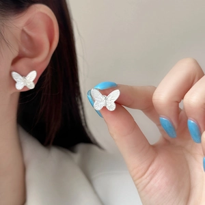 Exquisite matte silver butterfly stud earrings for women with elegant wing texture