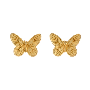 Detailed view of elegant gold butterfly studs with textured matte wings and polished finish