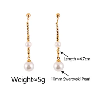 Elegant gold drop earrings with 10mm shell pearls and minimalist twisted metal rods
