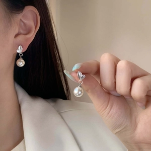Elegant silver leaf pearl drop earrings with polished white pearls for a sophisticated look