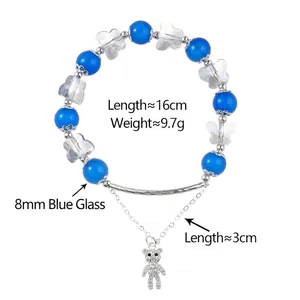 Bracelet en perles de verre bleues avec barre argentée et pendentif ours en cristal