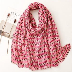 Pink cotton-linen feel scarf with gold foil geometric print and soft fringe edges