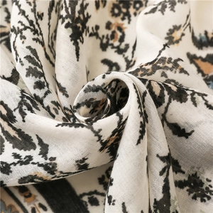 Close-up of soft cotton linen scarf showing breathable weave and retro floral pattern