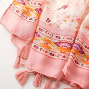 Detail of pink floral cotton-linen scarf showing delicate fringes and soft texture