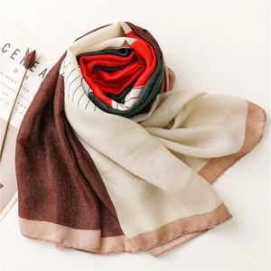 Detailed texture of cotton-linen shawl with color-block stripes and geometric patterns