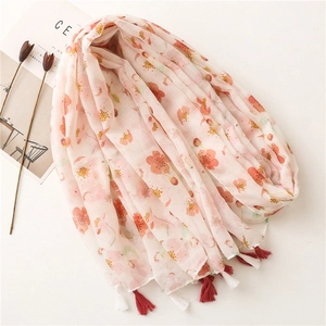 Light pink cotton linen scarf with cherry blossom prints and tassel fringe detail