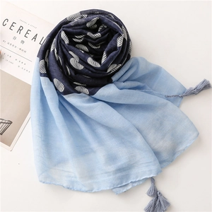 Lightweight polka dot cotton linen scarf with tassels and shell patterns in blue tones