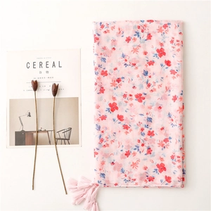 Pink floral cotton scarf for women featuring delicate fringe edges and a light breathable texture