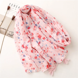 Pink floral cotton scarf with small red flowers and tassel fringe for sun protection