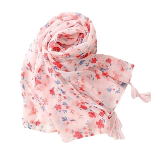 Lightweight pink floral scarf with red and blue flower patterns and elegant tassels
