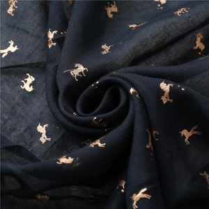 Dark blue lightweight cotton linen scarf with gold unicorn foil print and tassel hem