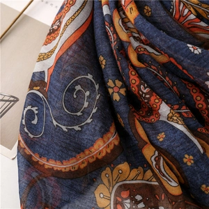 Close-up of navy paisley pattern on a soft cotton linen bohemian style scarf