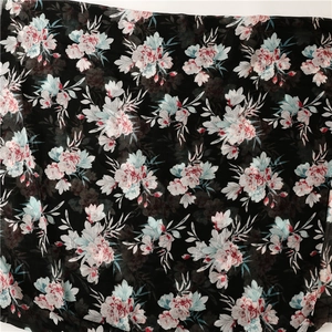 Close-up of floral print on Bali gauze scarf with pink flowers and blue leaves