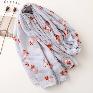 Écharpe florale en coton et lin avec motifs tropicaux et pompons pour la protection solaire plage