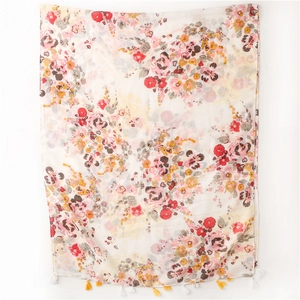 Detailed close-up of ink painting floral print fabric with delicate handmade tassels