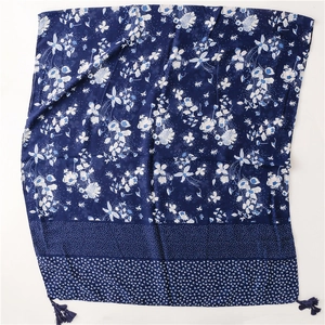 Detailed view of dark blue floral cotton linen scarf with tassels and pattern mix