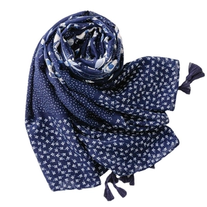 Navy blue cotton linen scarf with white floral patterns and tassel trim details