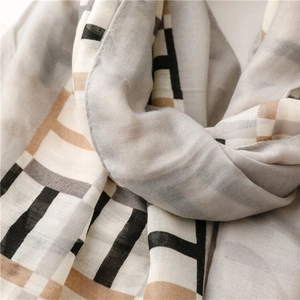 Detailed macro view of high-quality fabric texture with geometric pattern scarf