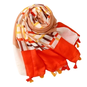 Fashionable geometric plaid scarf with orange and yellow color blocks and tassel edges