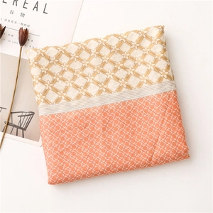 Close-up of lightweight cotton linen scarf featuring geometric patterns and floral print