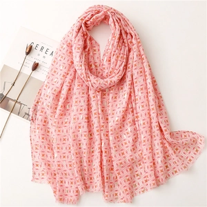 Pink geometric pattern scarf with gold foil printing and soft fringe edges for beach