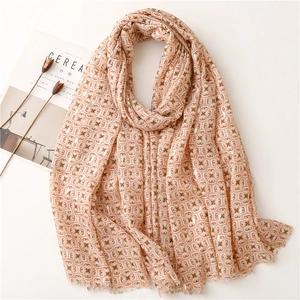 Elegant geometric print scarf with gold foil accents on a minimalist white background